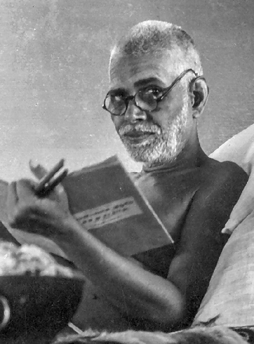 Bhagavan Sri Ramana Maharshi reading a book