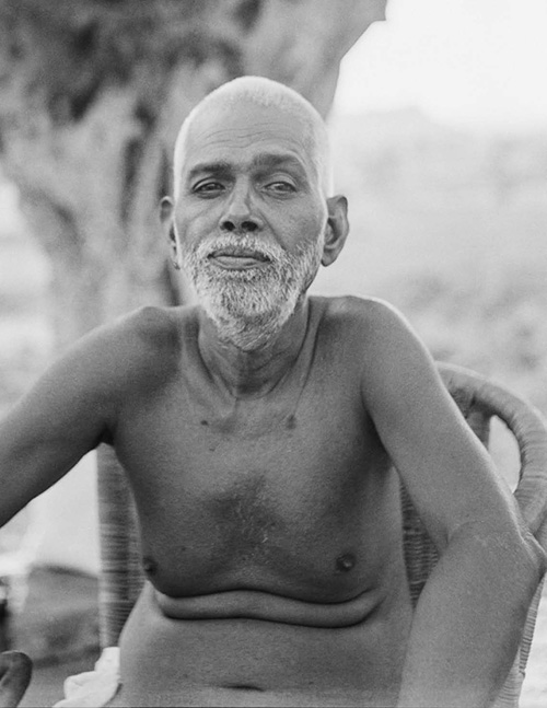 Bhagavan Sri Ramana Maharshi seated, photographed at Sri Ramanasramam