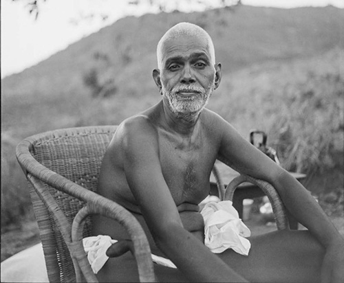 Bhagavan Sri Ramana Maharshi seated in a chair on the Hill